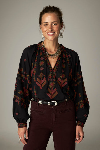 Robin Blouse in Charcoal, a slub cotton blouse with gathered round neckline and placed embroidery on the front, sleeves and cuffs