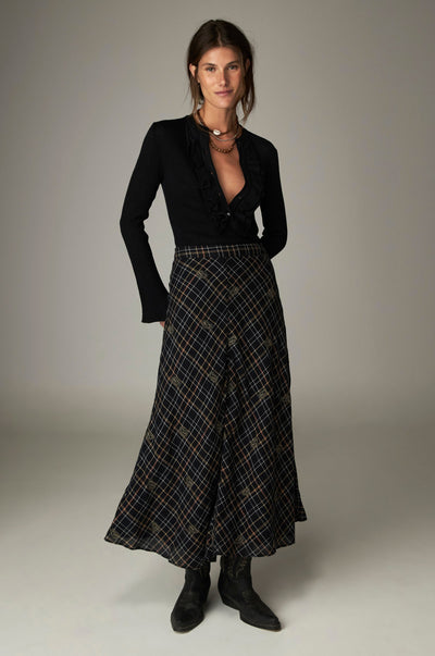 Nelly Skirt in Noir Plaid, a flared checked midi skirt in cotton lurex with bias-cut check and embroidered motifs