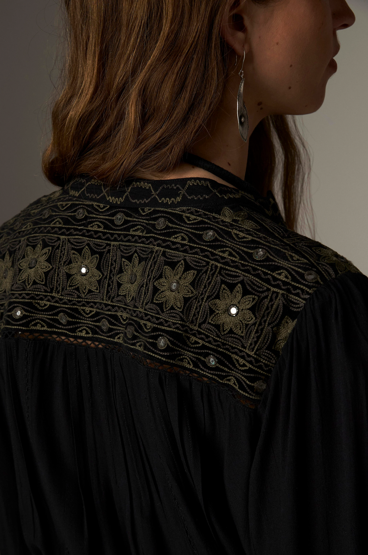 Marie Blouse in Onix, a Tencel crepe blouse with band collar, contrasting embroidery on the yokes and cuffs and mirror details