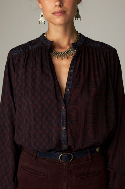Marie Blouse in Muddy Waters, a printed modal blouse with band collar, contrasting embroidery and mirror details