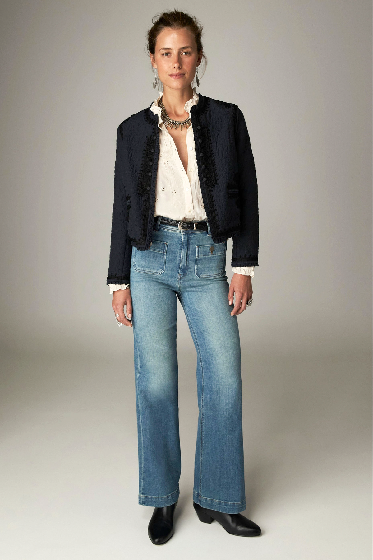 Paco Jacket in Ceniza, a cropped collarless viscose voile jacket with open front, embroidered trim and patch pockets
