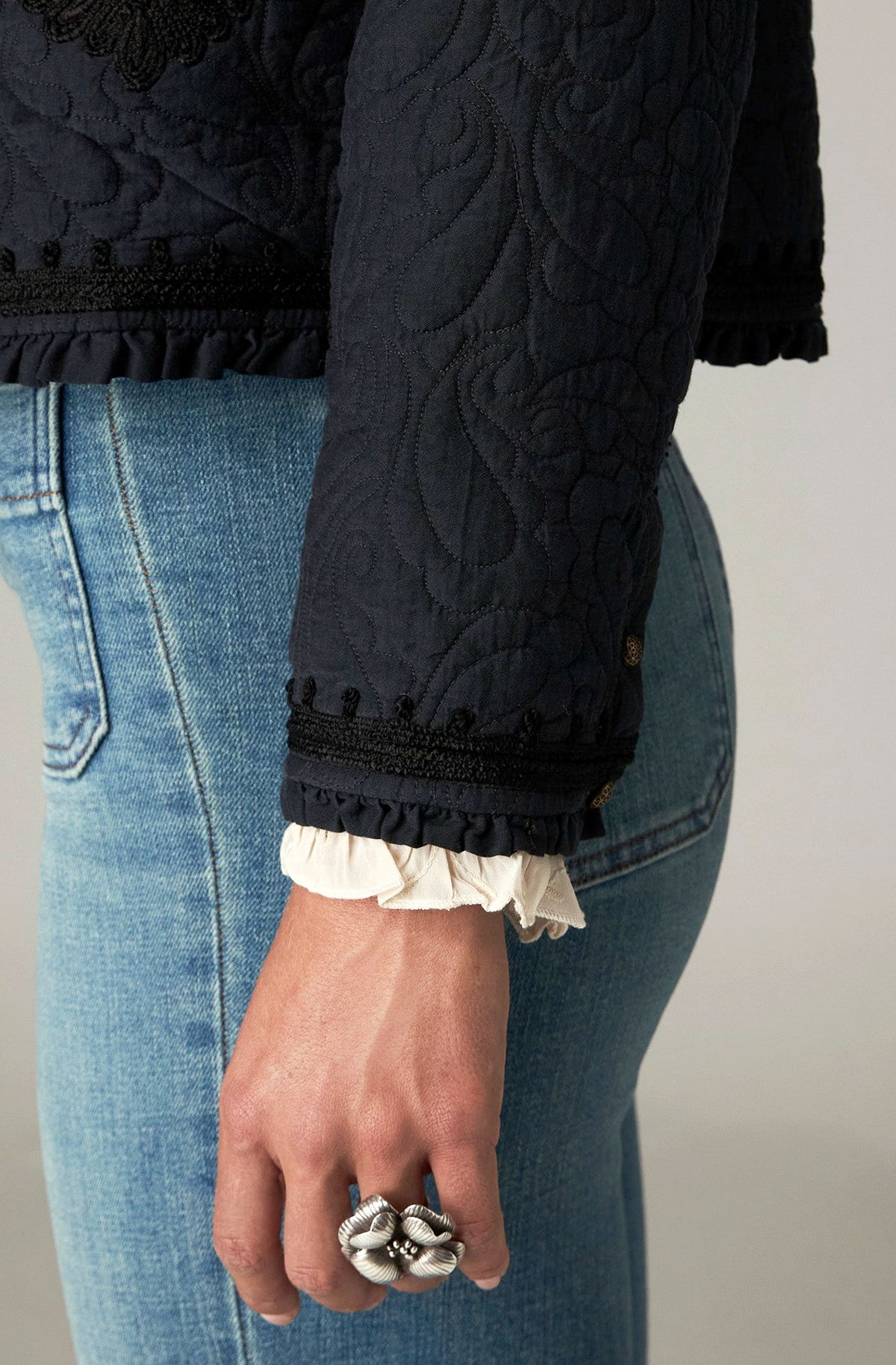 Paco Jacket in Ceniza, a cropped collarless viscose voile jacket with open front, embroidered trim and patch pockets
