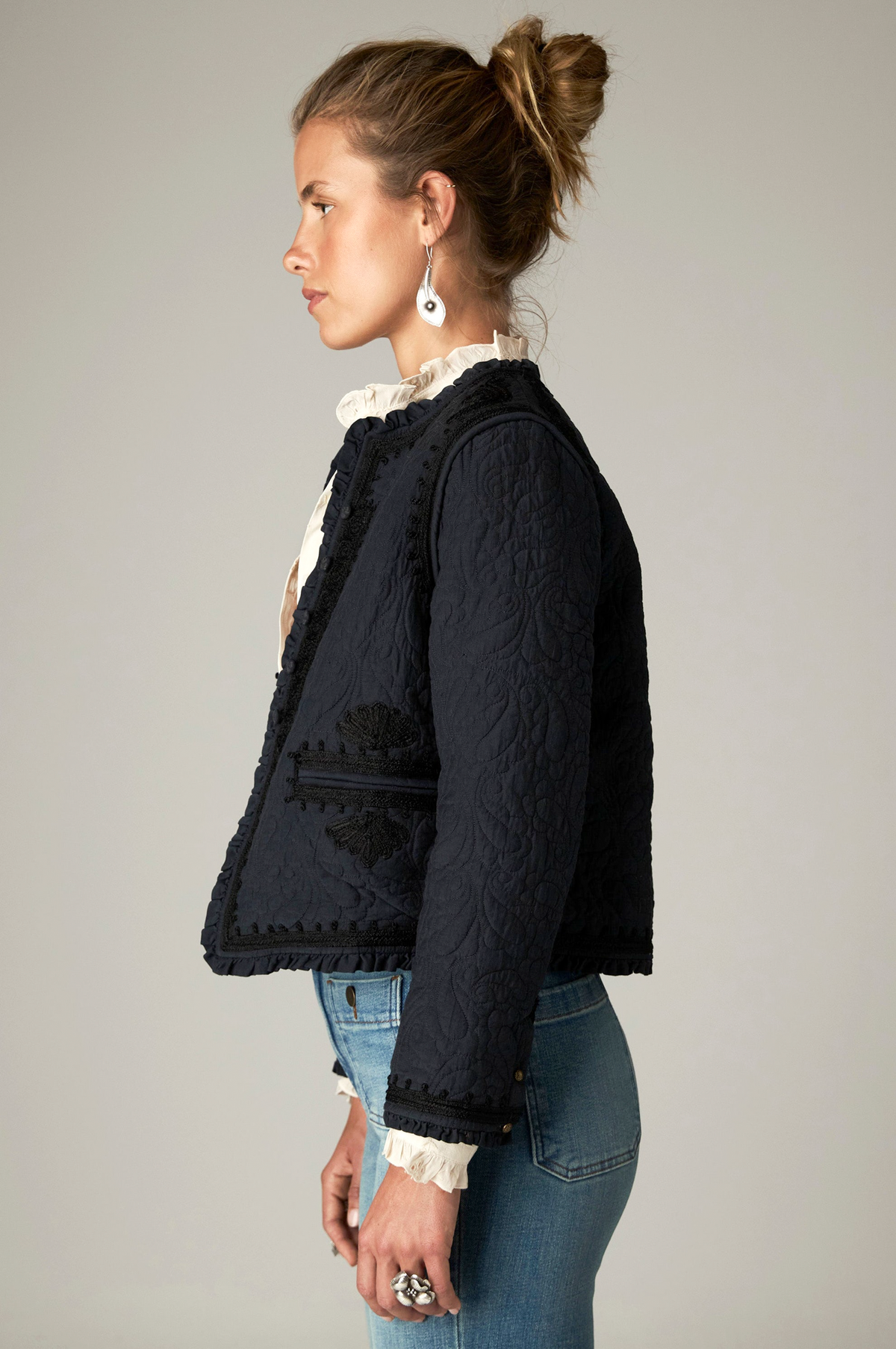 Paco Jacket in Ceniza, a cropped collarless viscose voile jacket with open front, embroidered trim and patch pockets