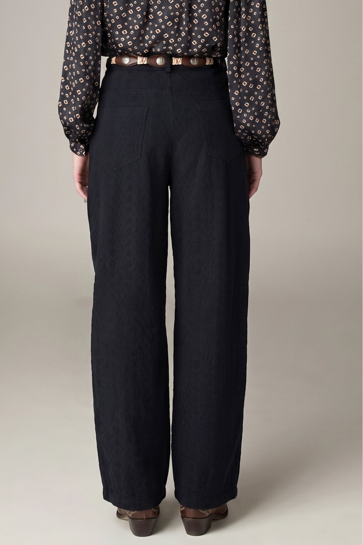 Pongo Pant in Charcoal, high-rise wide-leg schiffli denim trousers with front pleats and side pockets (product shot)